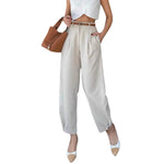 Women wearing white cropped straight leg pants