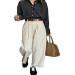 Women wearing beige high waist straight leg pants