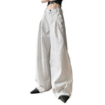 Women wearing white striped high waisted wide leg pants