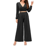 Women wearing black V-neck lounge set with wide leg pants