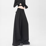 Women wearing black high waisted wide leg pants
